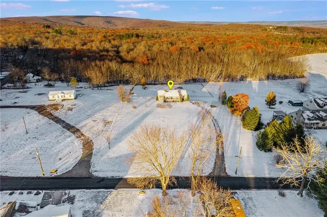 a kitchen with stainless steel appliances granite countertop a sink dishwasher stove and refrigerator