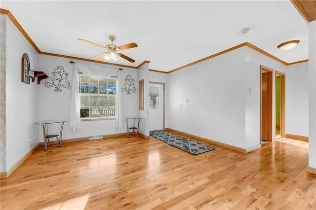 a kitchen with stainless steel appliances kitchen island a stove and a microwave