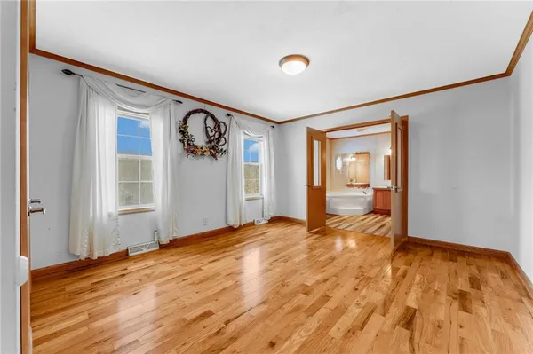 a bathroom with a tub shower and sink