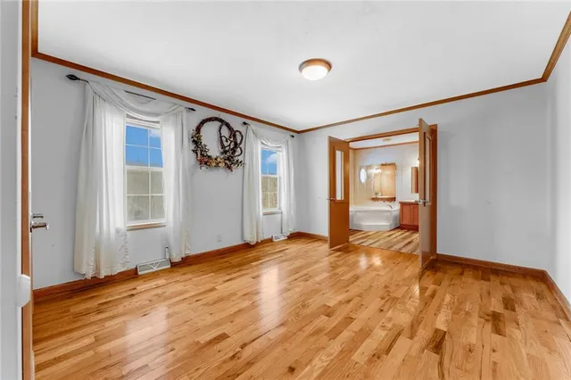 a bathroom with a tub shower and sink
