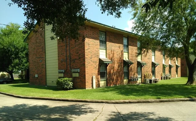 a front view of house with a garden