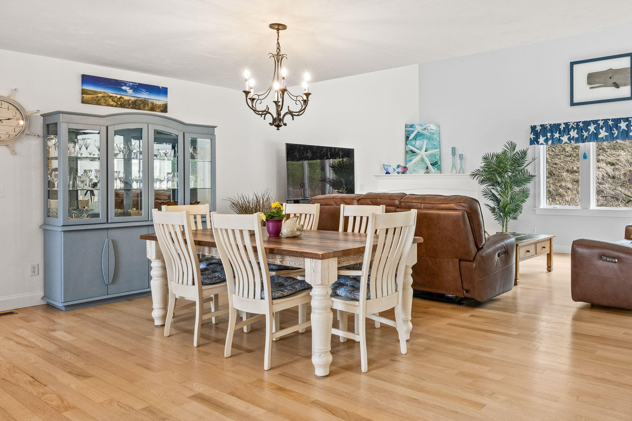11 Aspen Road Buzzards Bay, MA 02532 - Photo 14 of 43 a view of a dining room with furniture a chandelier and wooden floor