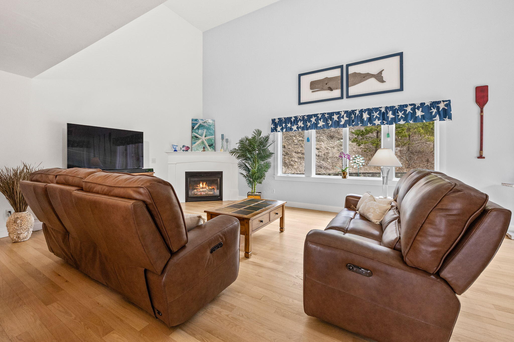 11 Aspen Road Buzzards Bay, MA 02532 - Photo 15 of 43 a living room with furniture a fireplace and a window