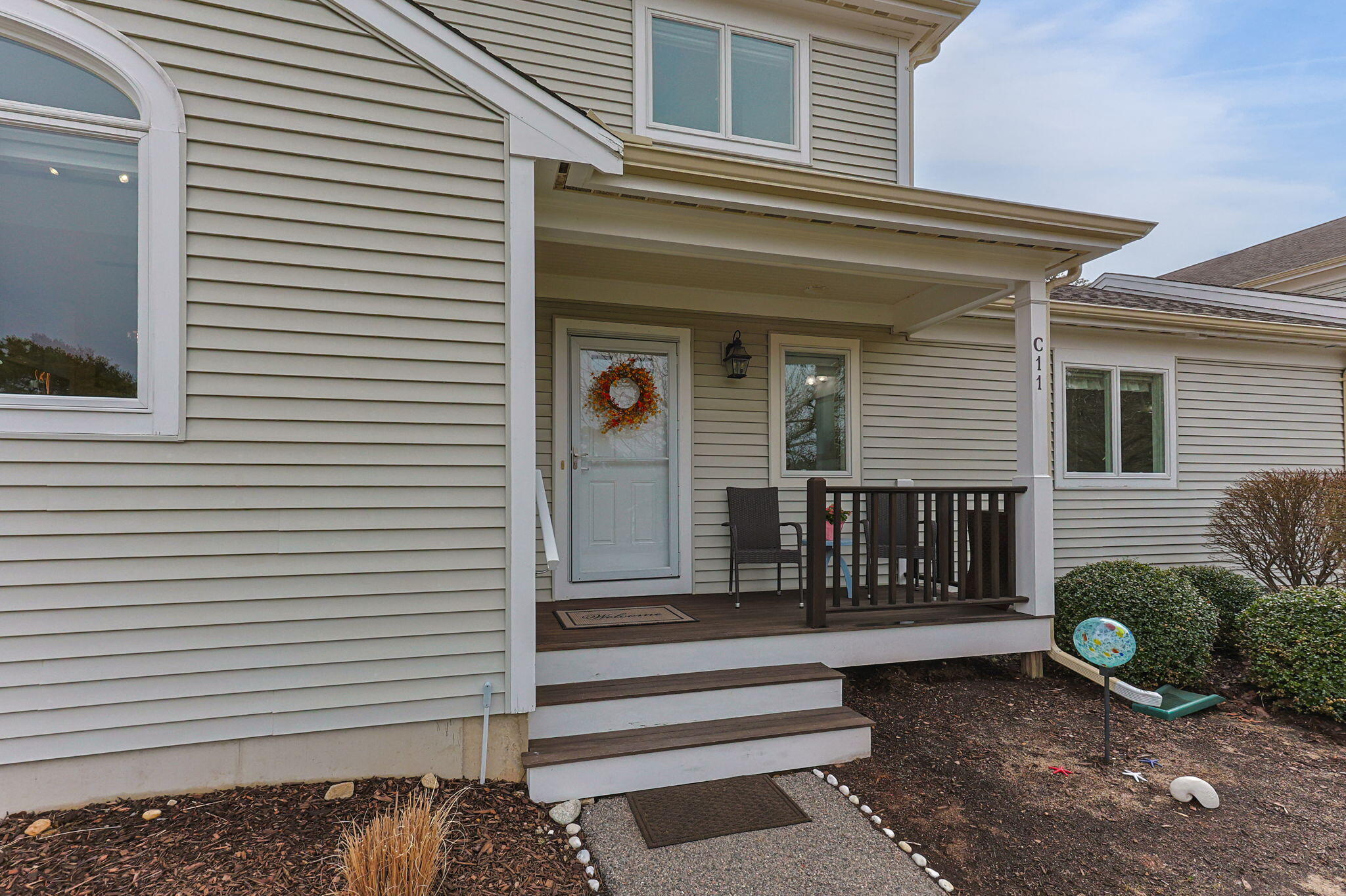 11 Aspen Road Buzzards Bay, MA 02532 - Photo 2 of 43 a view of a house with a small yard and a large window