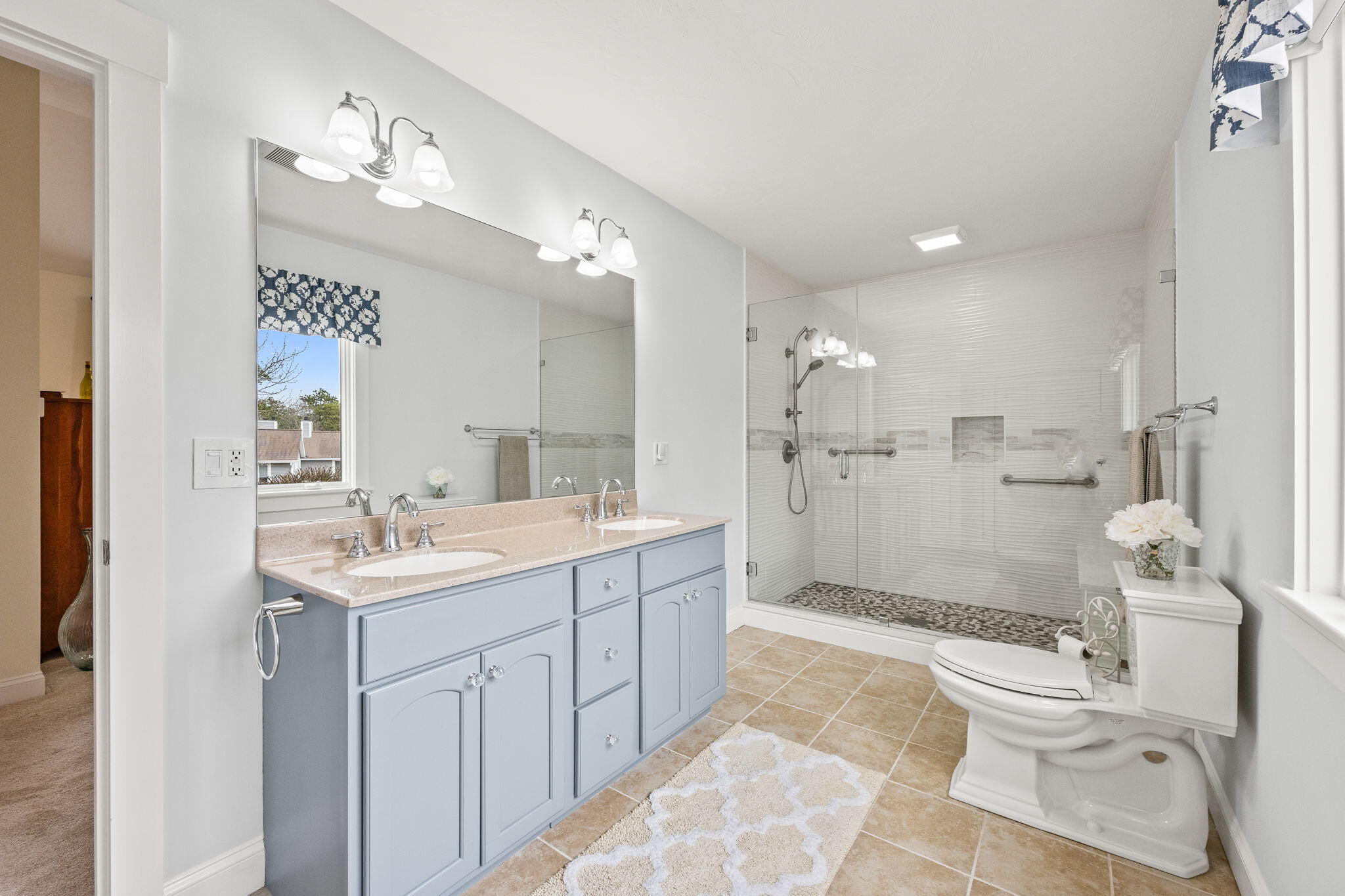 11 Aspen Road Buzzards Bay, MA 02532 - Photo 21 of 43 a bathroom with a granite countertop sink a toilet a mirror and shower