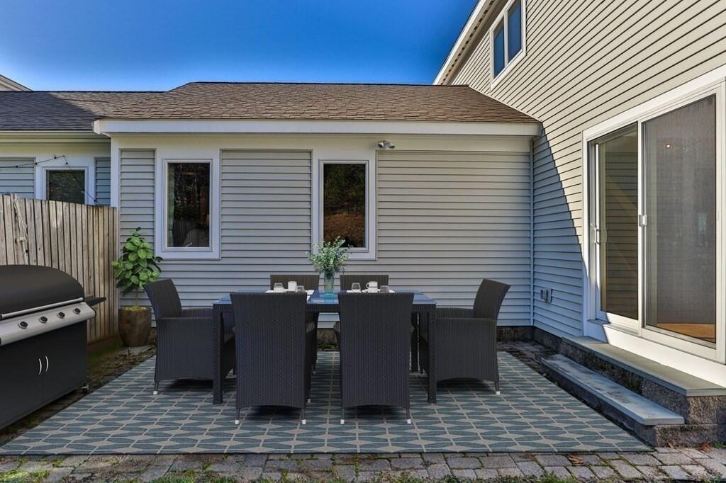 11 Aspen Road Buzzards Bay, MA 02532 - Photo 31 of 43 a view of a dinning tables and chairs in back porch