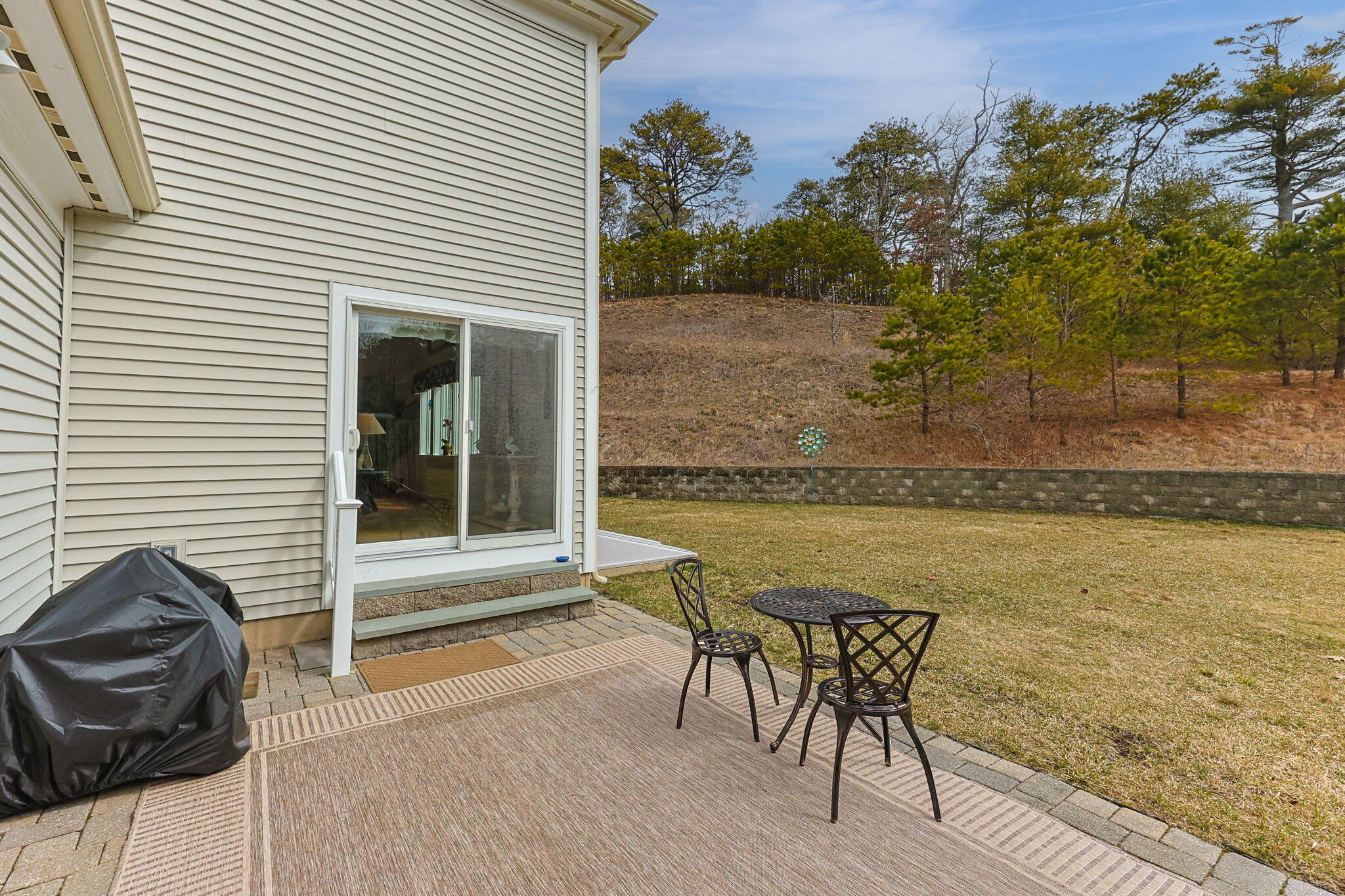 11 Aspen Road Buzzards Bay, MA 02532 - Photo 34 of 43 a view of a chairs and table on the terrace