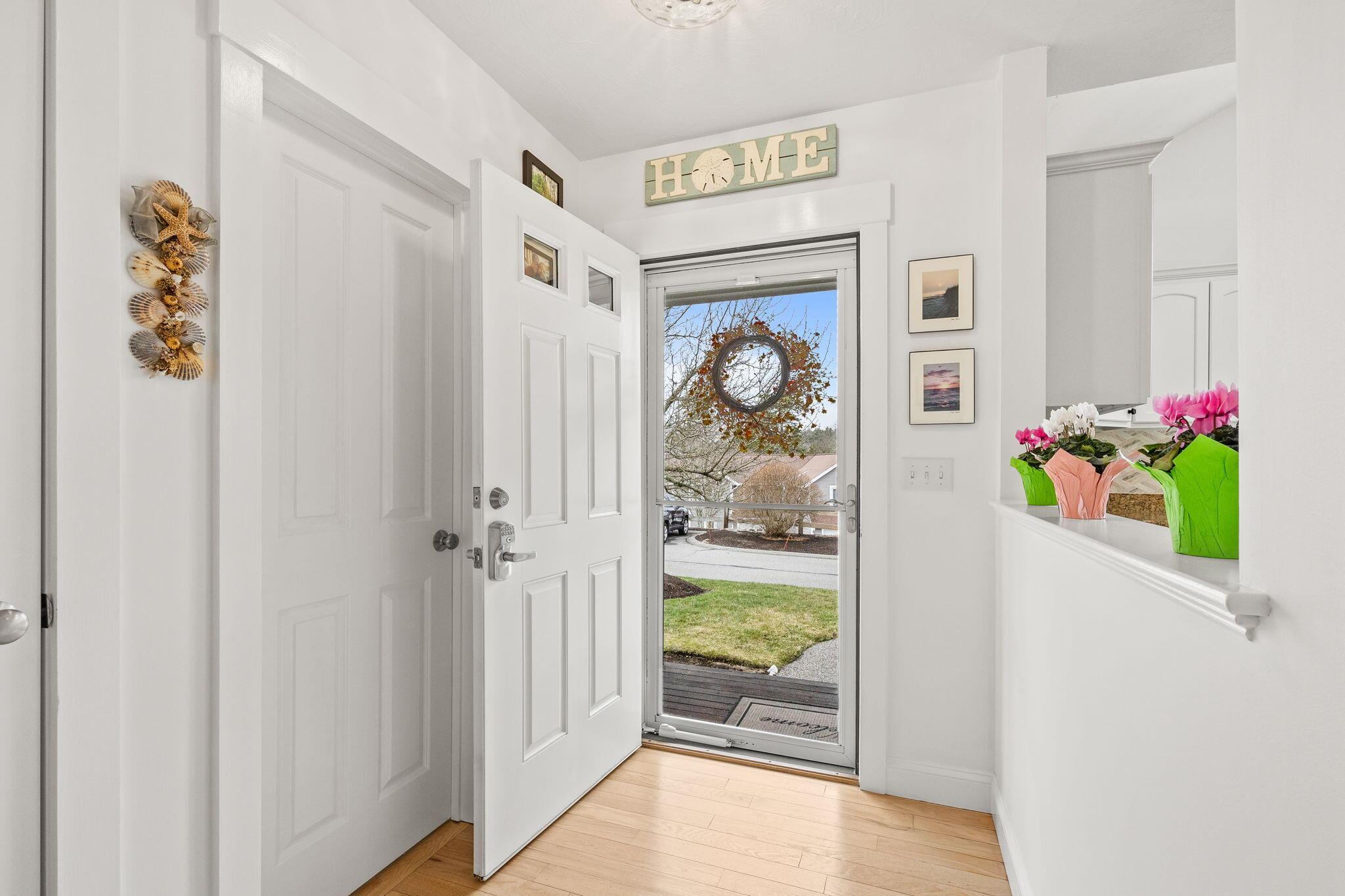 11 Aspen Road Buzzards Bay, MA 02532 - Photo 4 of 43 a view of a hallway with wooden floor and a workspace