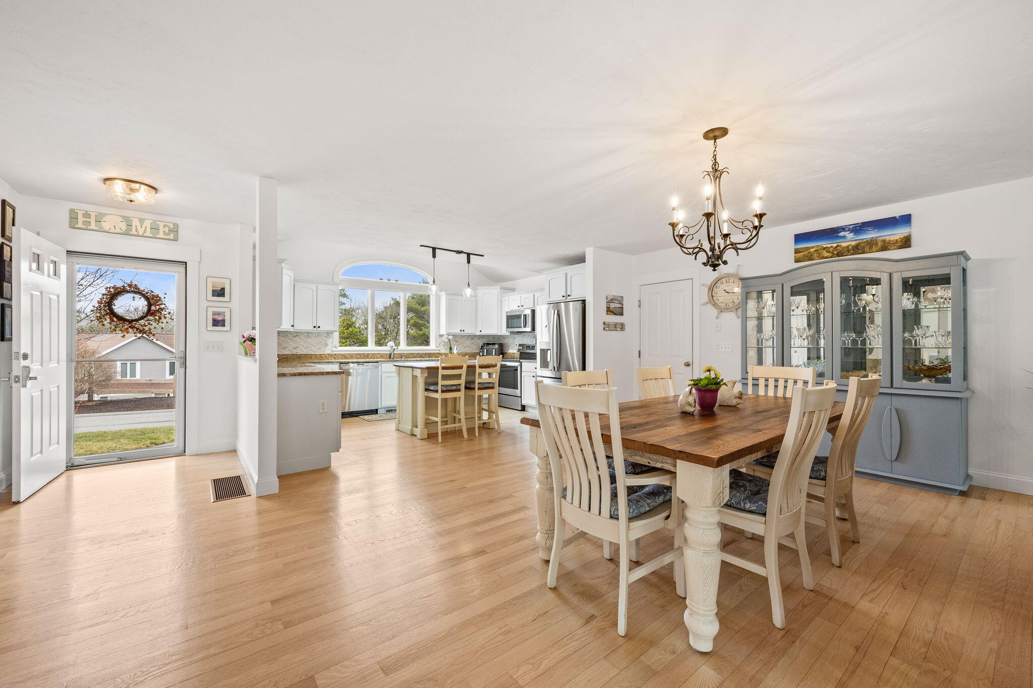 11 Aspen Road Buzzards Bay, MA 02532 - Photo 6 of 43 a view of a dining room with furniture and wooden floor