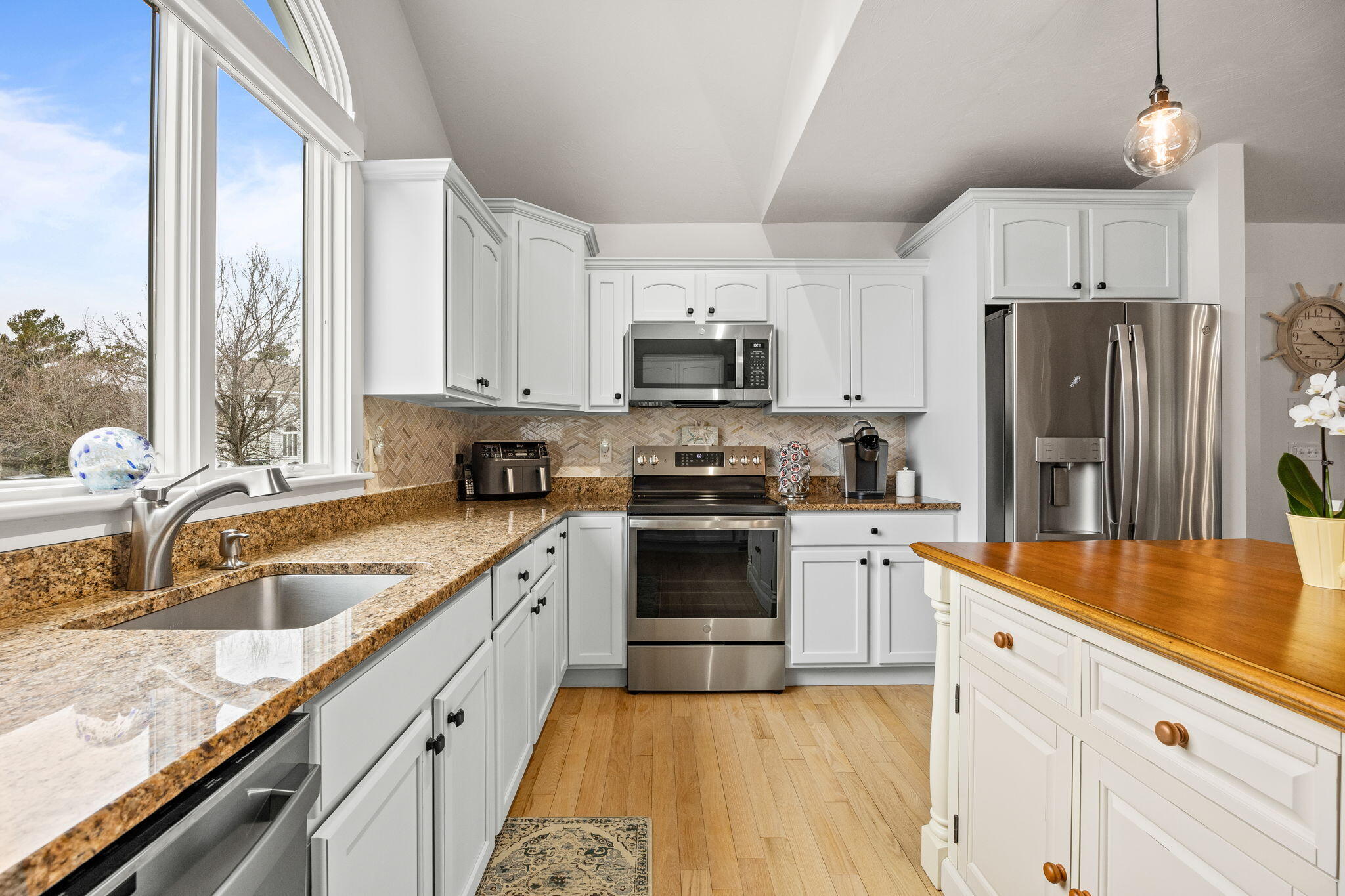 11 Aspen Road Buzzards Bay, MA 02532 - Photo 7 of 43 a kitchen with granite countertop a refrigerator stove top oven and sink