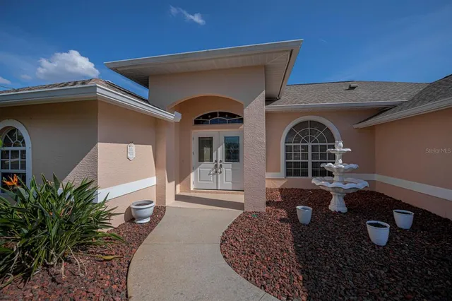 a view of a livingroom with furniture and a window
