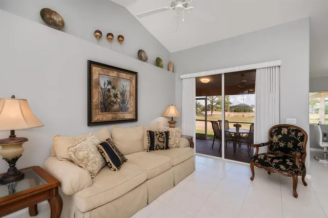 a view of a kitchen with white cabinets