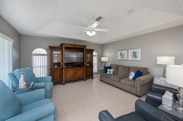 a spacious bathroom with a mirror a sink and a shower