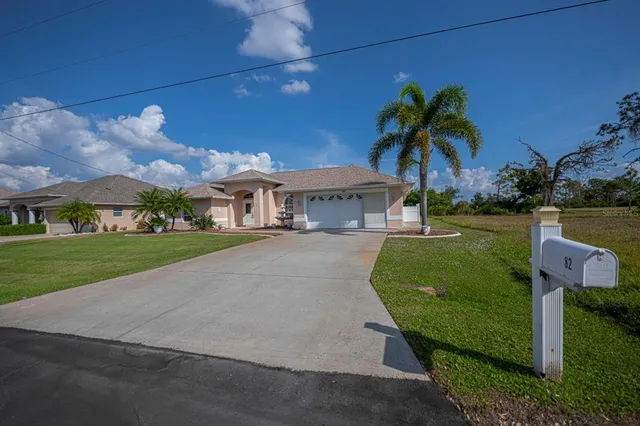 an aerial view of a city with lots of residential buildings lake and ocean view