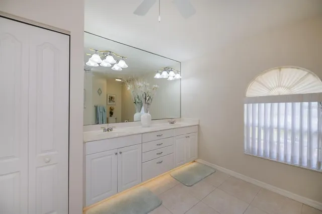 a utility room with sink dryer and washer