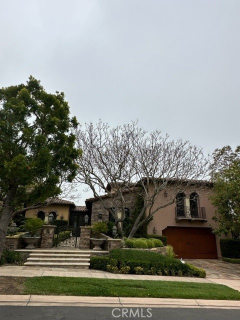 35 Overlook Drive Newport Coast, CA 92657 - Photo 2 of 3 a front view of a house with a yard