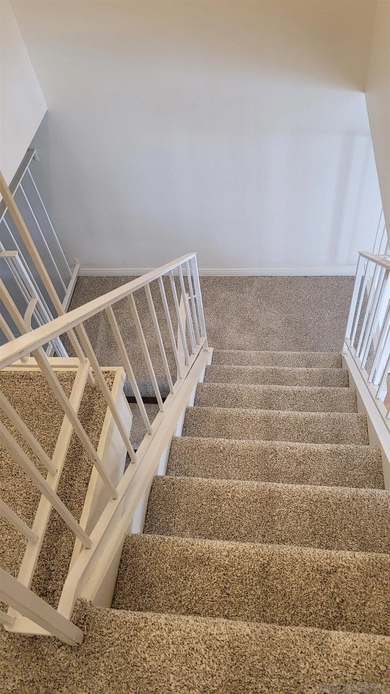 863 Del Mar Downs Road, Unit D Solana Beach, CA 92075 - Photo 14 of 23 a view of staircase with white walls
