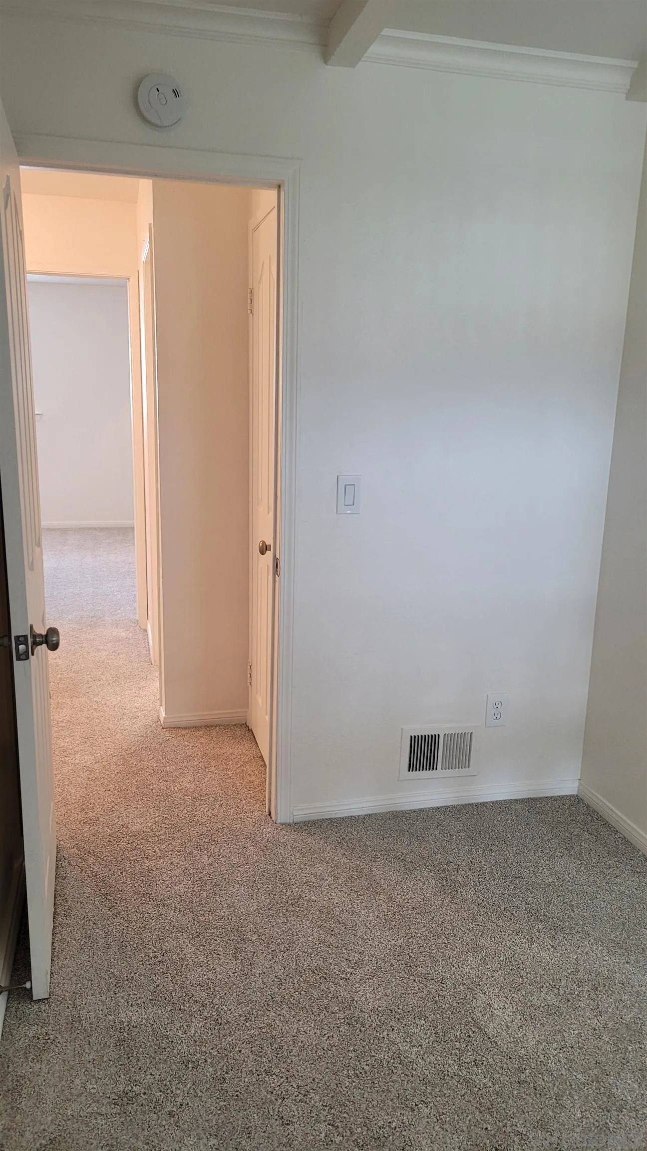 863 Del Mar Downs Road, Unit D Solana Beach, CA 92075 - Photo 18 of 23 an empty room with a door