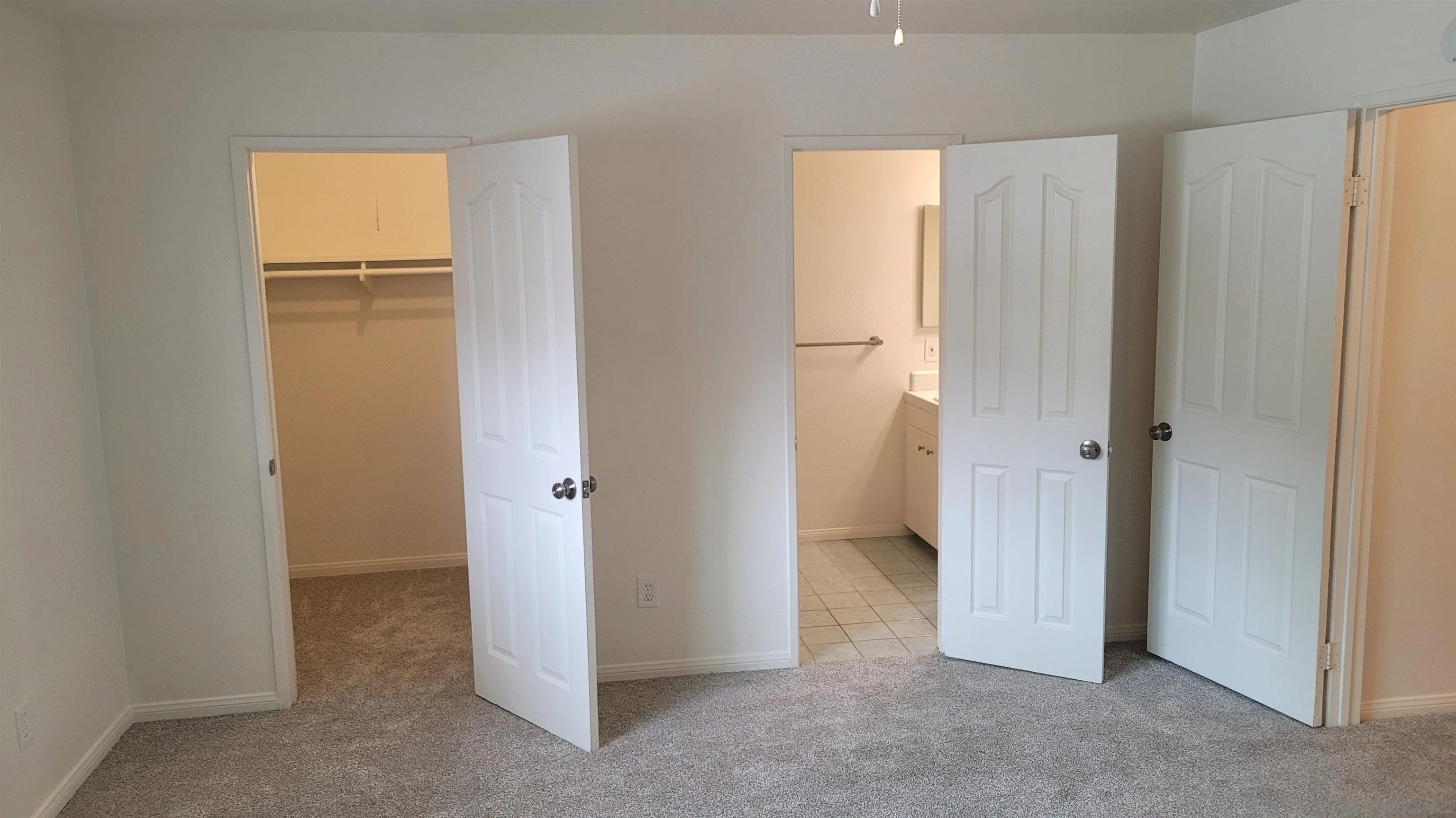 863 Del Mar Downs Road, Unit D Solana Beach, CA 92075 - Photo 19 of 23 a view of an empty room with closet and a window