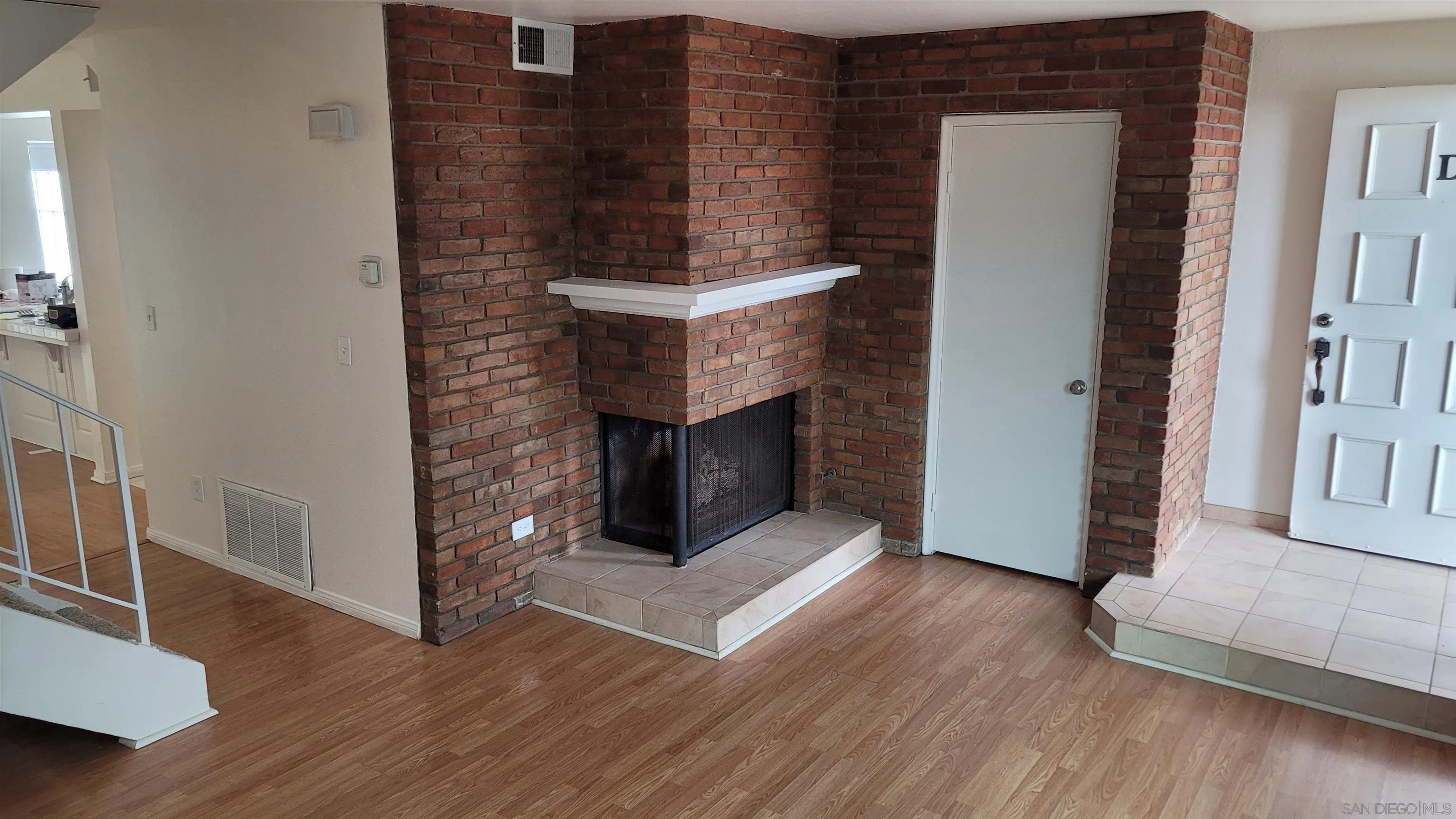 863 Del Mar Downs Road, Unit D Solana Beach, CA 92075 - Photo 3 of 23 a living room with a fireplace