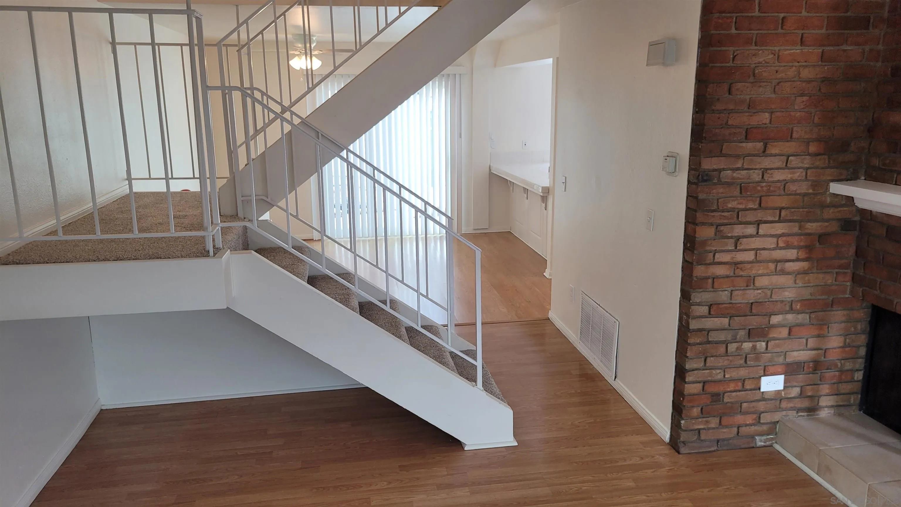 863 Del Mar Downs Road, Unit D Solana Beach, CA 92075 - Photo 5 of 23 a view of entryway and hall with wooden floor