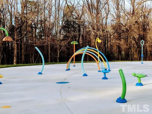 a bench is sitting in the middle of a yard