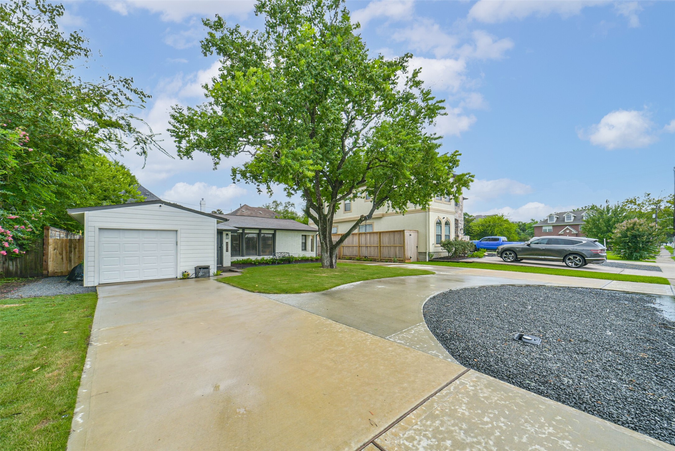 6205 South Rice Avenue Bellaire, TX 77401 - Photo 2 of 21 a view of a house with yard and large trees