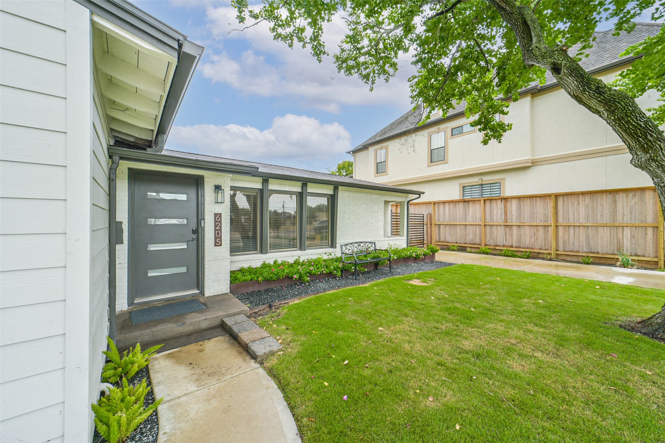 6205 South Rice Avenue Bellaire, TX 77401 - Photo 3 of 21 a view of a house with a garden