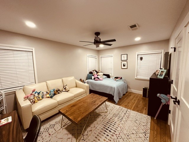 6205 South Rice Avenue Bellaire, TX 77401 - Photo 9 of 21 a bedroom with bed and a chandelier