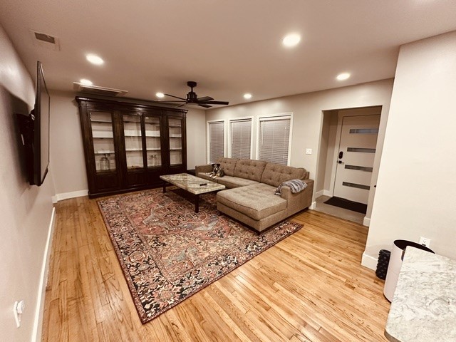6205 South Rice Avenue Bellaire, TX 77401 - Photo 10 of 21 a living room with a couch and a rug