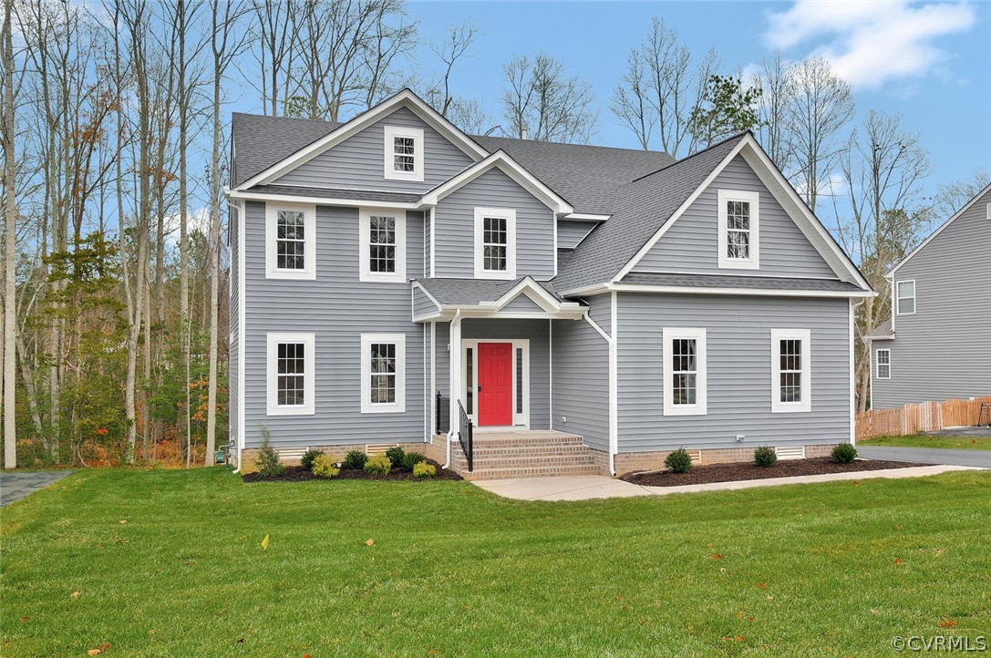 11525 Avening Road Midlothian, VA 23112 - Photo 1 of 1 a front view of a house with a yard and garage
