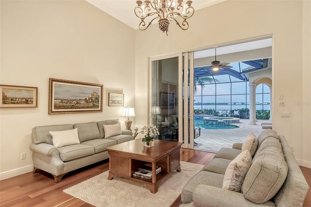 811 Riviera Dunes Way Palmetto, FL 34221 - Photo 13 of 92 a living room with furniture and a large window