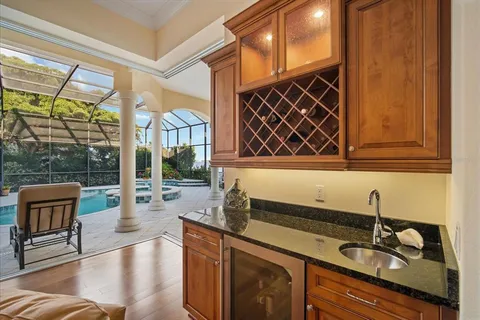 a spacious bathroom with a tub a sink and mirror