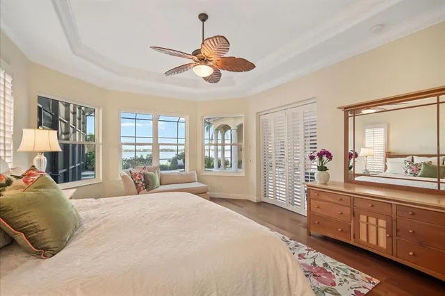 a bedroom with a large bed and a large window