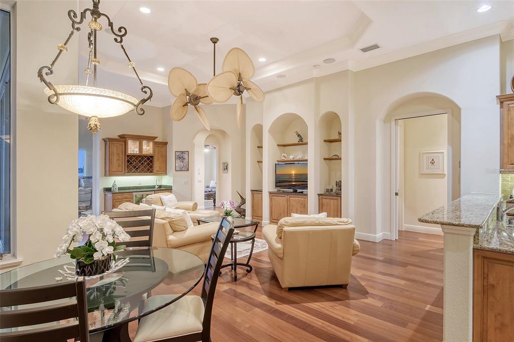 811 Riviera Dunes Way Palmetto, FL 34221 - Photo 26 of 92 a living room with furniture a chandelier and wooden floor