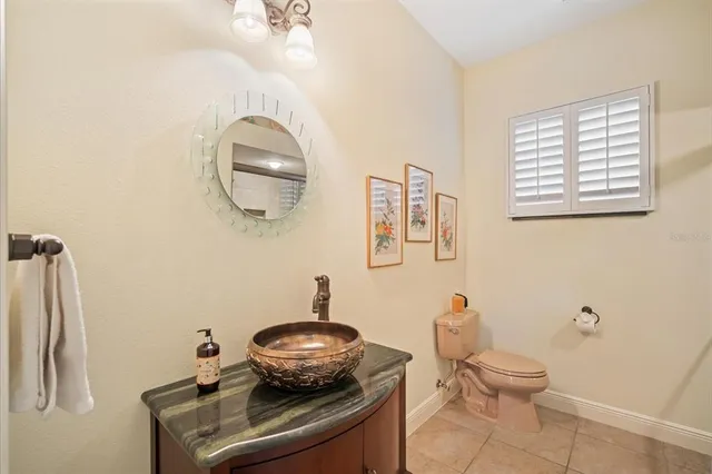 a view of a livingroom with furniture and a large window