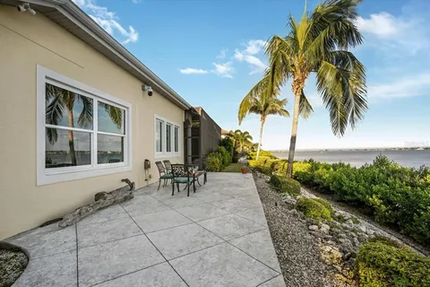 an aerial view of a house with a lake view