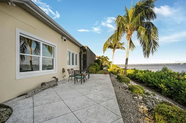 an aerial view of a house with a lake view