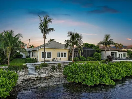 a front view of house with outdoor space and sitting space