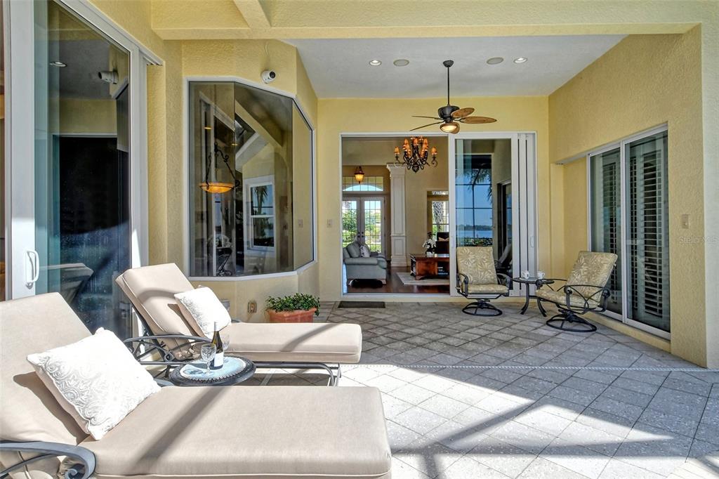 811 Riviera Dunes Way Palmetto, FL 34221 - Photo 61 of 92 a outdoor space with patio lots of furniture and windows