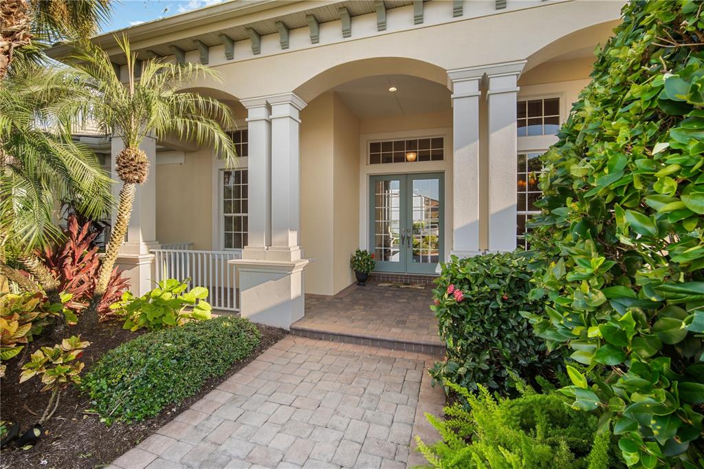 811 Riviera Dunes Way Palmetto, FL 34221 - Photo 7 of 92 a view of a brick house with potted plants