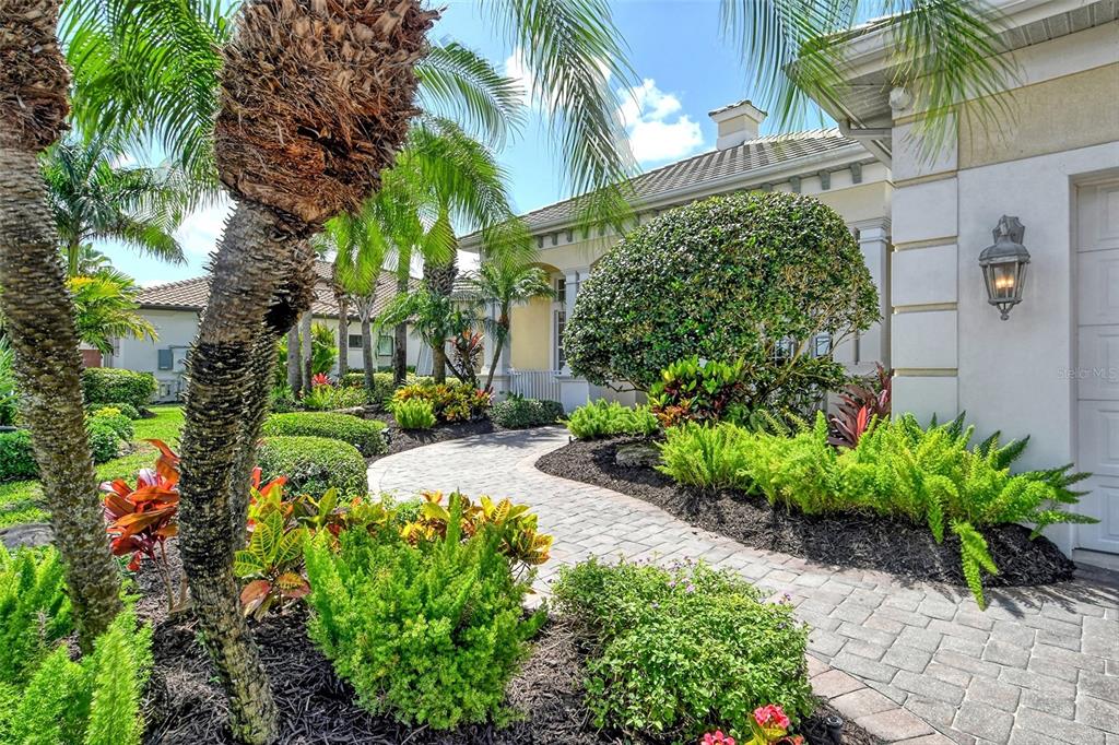 811 Riviera Dunes Way Palmetto, FL 34221 - Photo 87 of 92 a view of a garden with a building