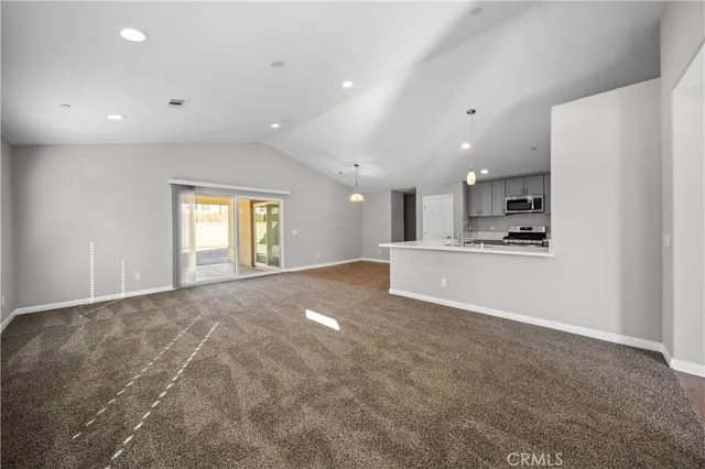 a view of a kitchen with a sink and cabinets
