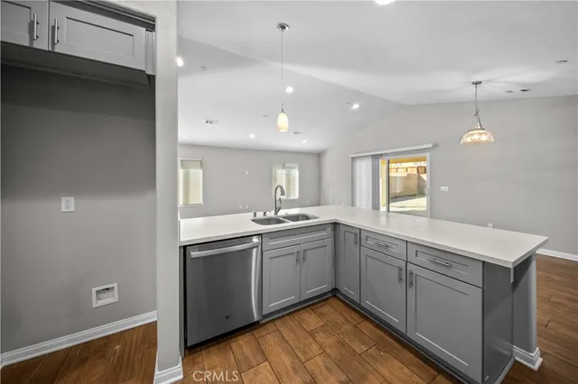 a kitchen with sink stove and microwave