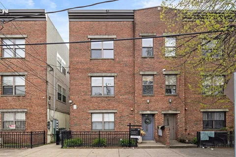 a front view of a building and a street
