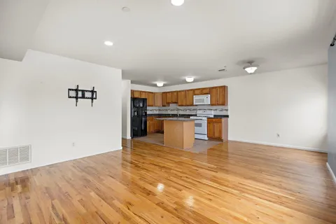 a view of kitchen with wooden floor