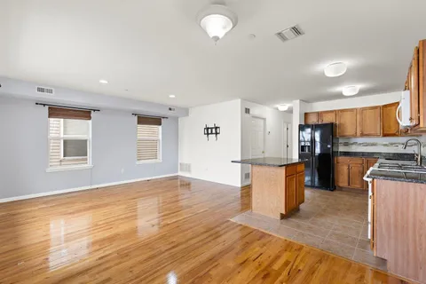 a view of kitchen with cabinets and wooden floor