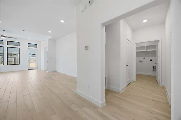 wooden floor with white walls