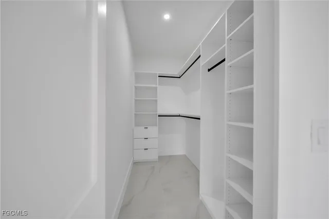 a bathroom with a double vanity sink mirror and shower