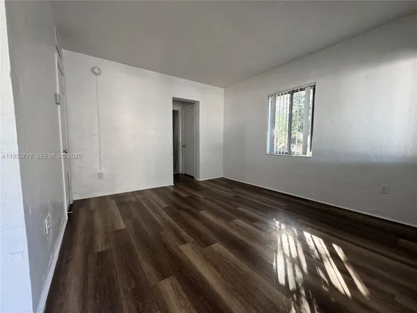 a view of an empty room and window